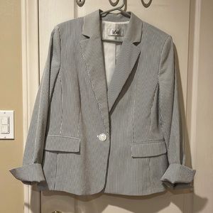 Charcoal gray and white striped blazer.